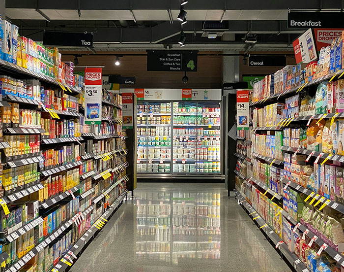 Grocery aisle in the US showcasing current prices, highlighting concerns over insane grocery costs in America.