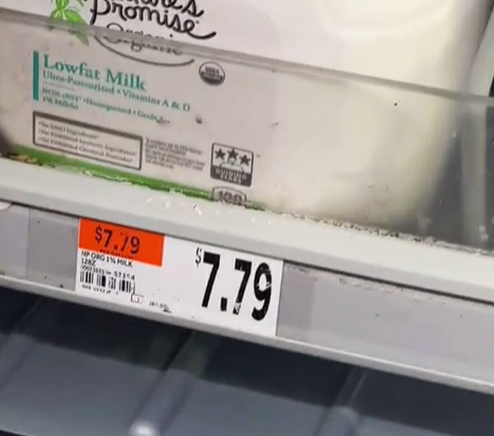 Grocery prices in the US showing milk priced at $7.79, highlighting economic concerns.