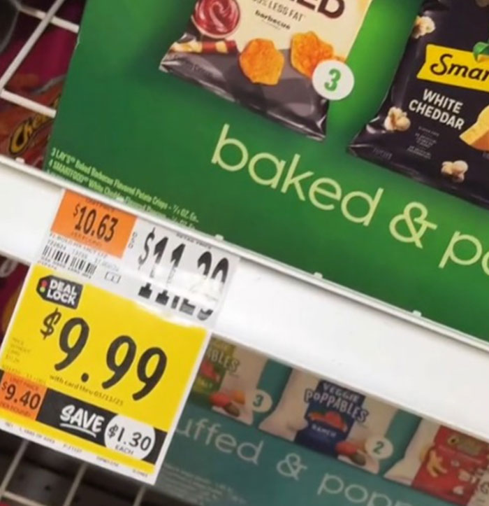 Grocery shelf showing high prices of snacks in the US, including a sale tag for $9.99, highlights economic concerns.