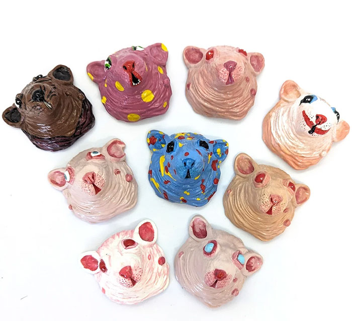 Colorful handmade crafts featuring quirky animal faces arranged in a circle.