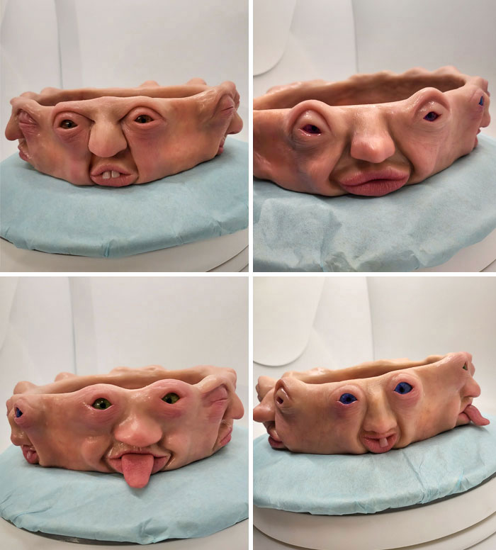 Creepy handmade craft featuring a bowl with faces and expressive eyes, displayed on a blue cloth.