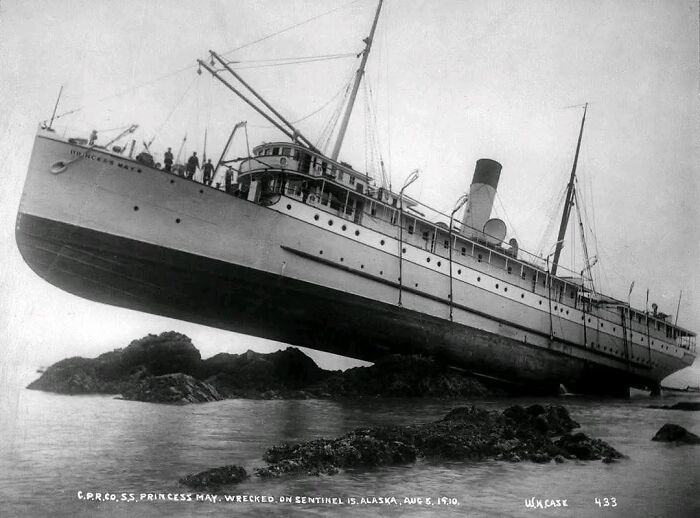 Historical shipwreck of SS Princess May on rocks, Sentinel Island, Alaska, 1910, evoking nostalgia with its vintage charm.