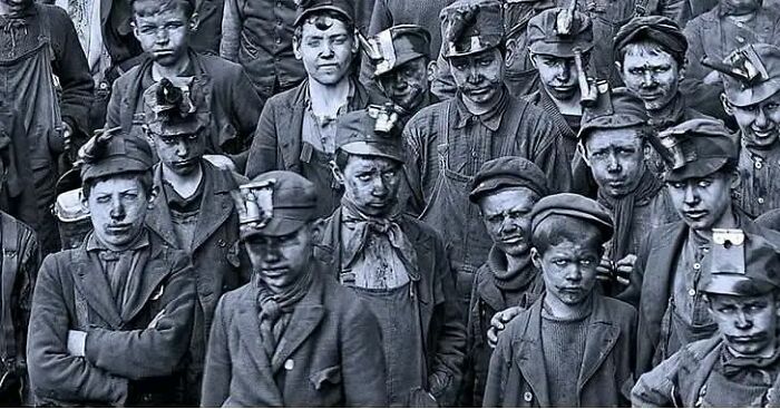 Historical pic of young coal miners with dirty faces and work clothes, evoking nostalgia.