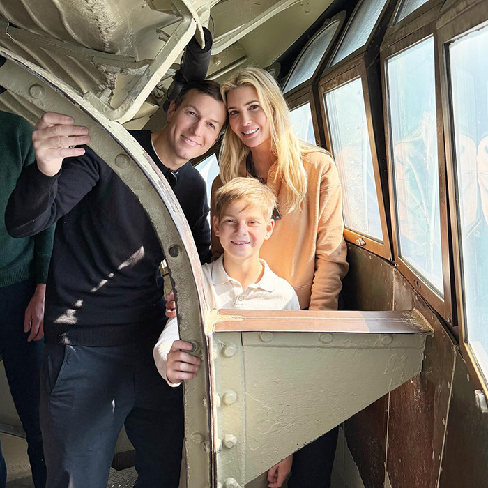 Family smiling inside a vintage aircraft cabin, sparking Ivanka Trump concerns. Family smiling inside a vintage aircraft cabin, sparking Ivanka Trump concerns.