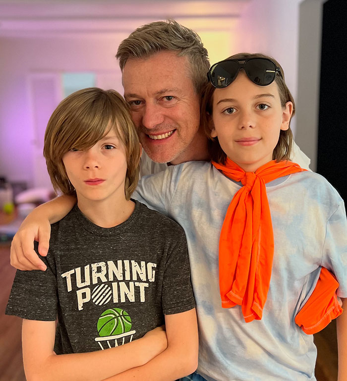 Jaime King with two children, one wearing glasses on head and orange scarf, highlighting custody discussion. Jaime King with two children, one wearing glasses on head and orange scarf, highlighting custody discussion.