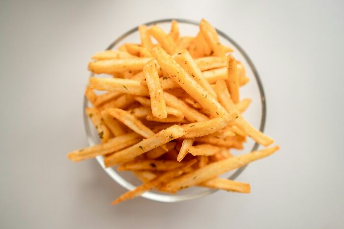Bowl of french fries symbolizing a lifetime supply winning, seasoned and arranged neatly.