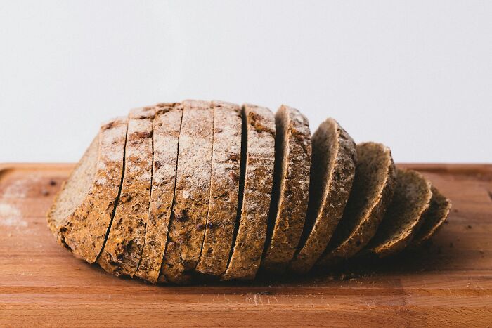 Sliced loaf of bread on a wooden board, representing a lifetime supply winner's story.