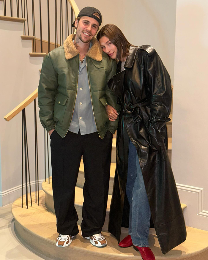 Justin Bieber and Hailey Bieber posing for a photo indoors.