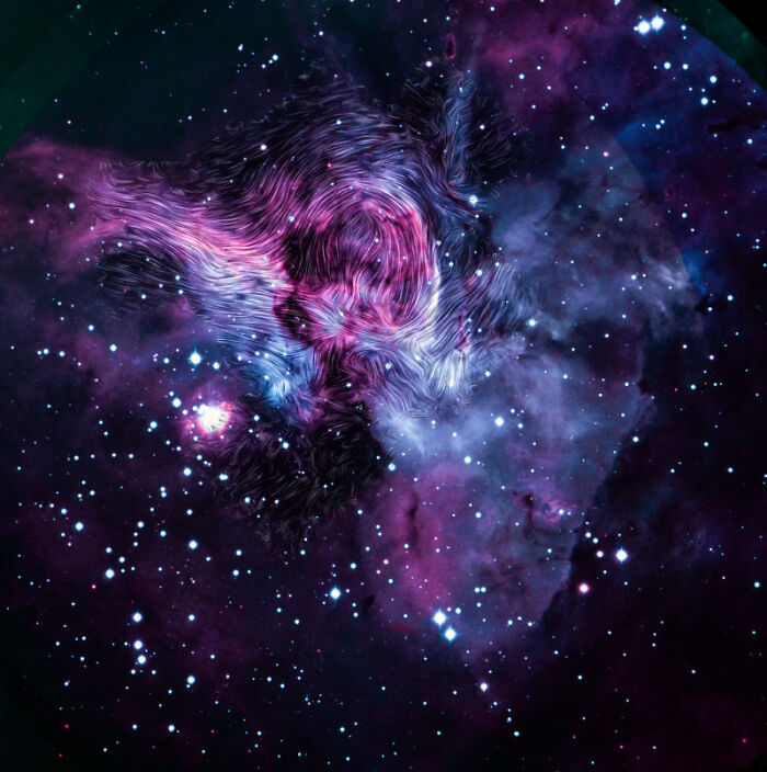 Purple and pink nebula in deep space with bright stars scattered throughout; a stunning display of cosmic beauty.