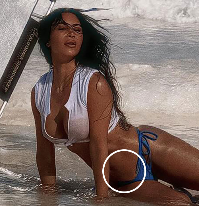 Woman in a bikini posing on the beach with a circle highlighting potential Photoshop area. Woman in a bikini posing on the beach with a circle highlighting potential Photoshop area.