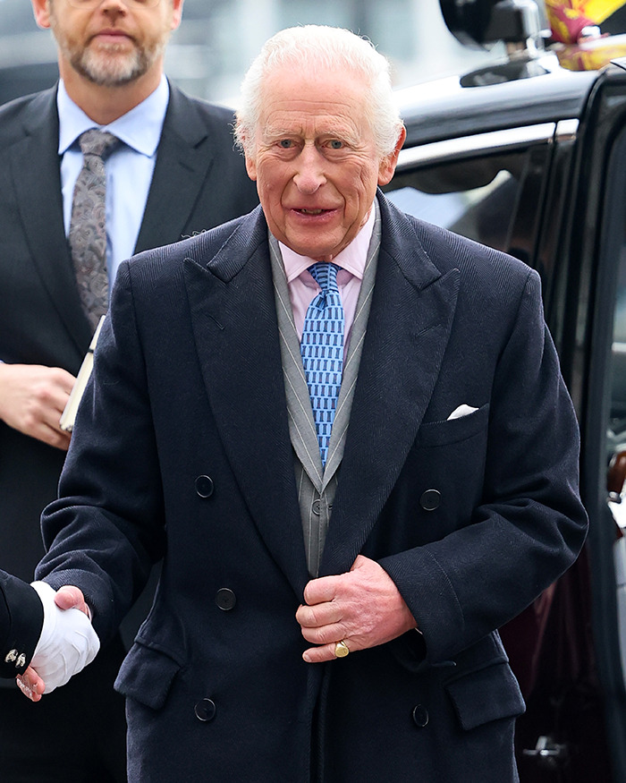 Elderly man in a navy coat and tie, stepping out of a car amidst hospitalization news; cancer battle evokes public concern. Elderly man in a navy coat and tie, stepping out of a car amidst hospitalization news; cancer battle evokes public concern.