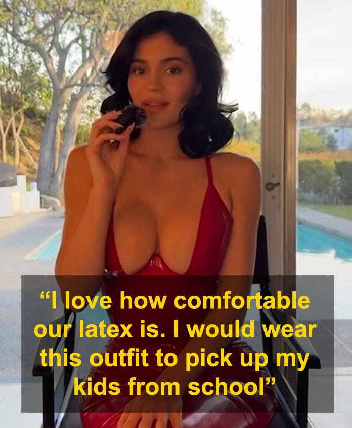 Woman in revealing red dress by pool, sparking controversy about fashion choices.