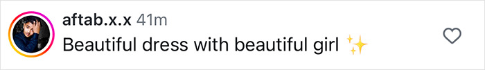 "Comment praising a beautiful girl in a stunning dress with sparkling emoji.