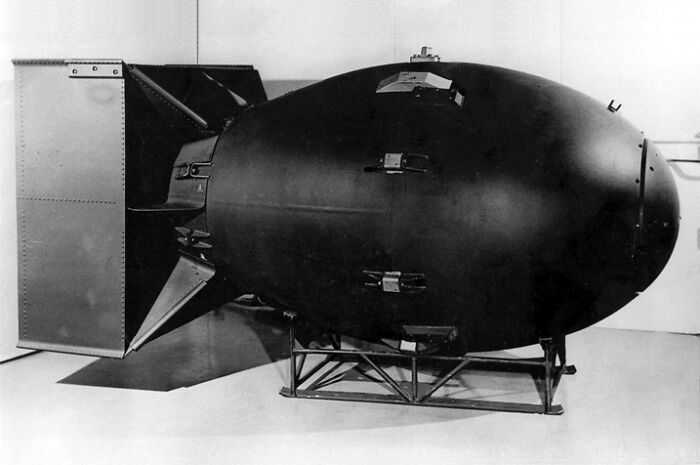 Historic atomic b**b displayed on stand, representing last-minute decisions that changed the course of history.