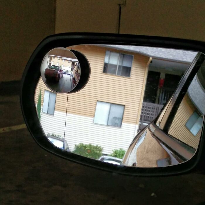 Car mirror with blind spot mirror, aiding visibility and reducing chaos in adult driving.