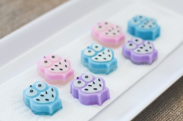 Colorful owl-shaped soaps on a white dish, illustrating lost friendships creatively.