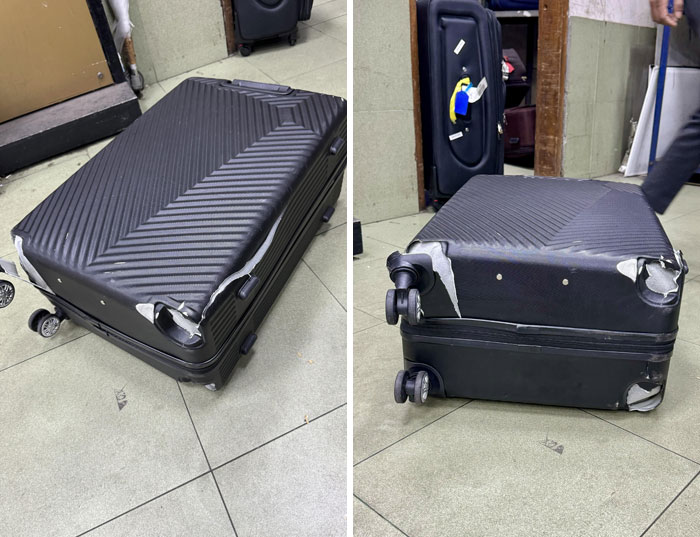Damaged airline baggage with torn edges and scratches on the floor.