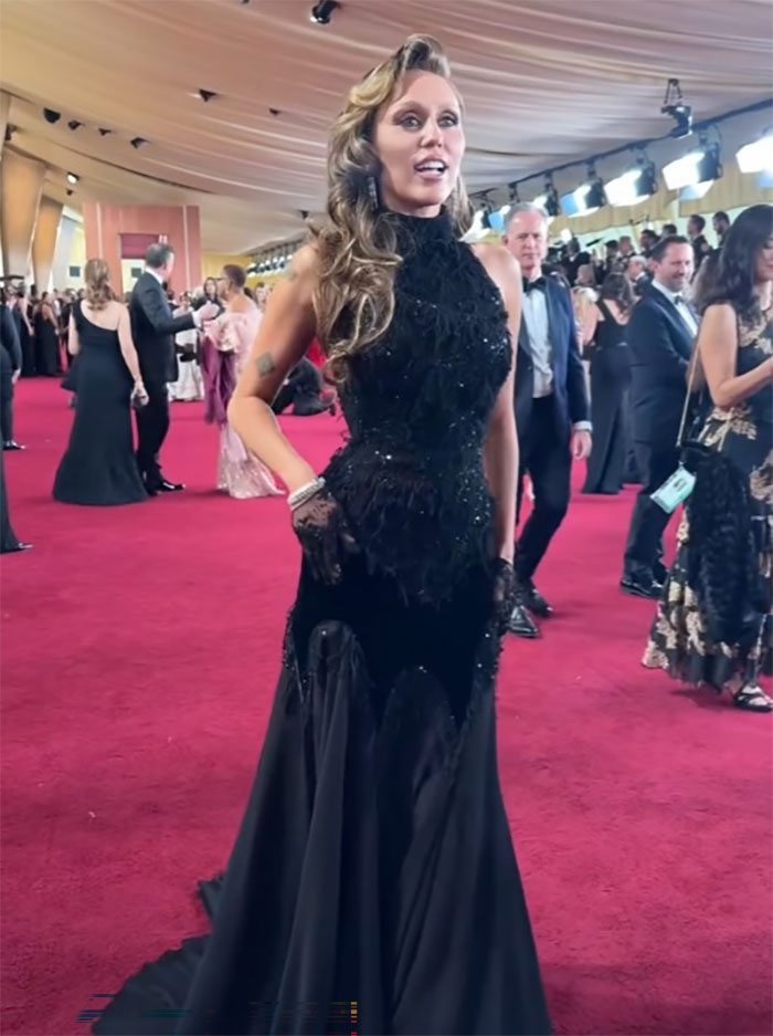 Person in a black gown with bleached eyebrows on the Oscars 2025 red carpet. Person in a black gown with bleached eyebrows on the Oscars 2025 red carpet.
