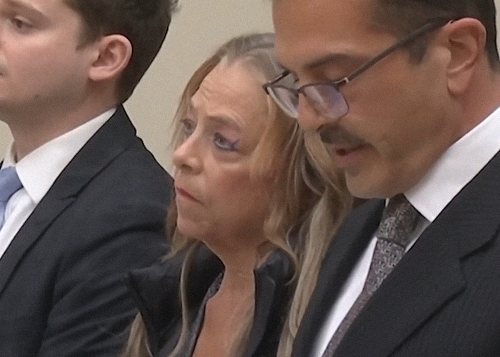 Woman in court, a keyword from the article title: mom allegedly imprisoned stepson.