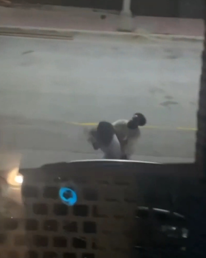 Traffic camera view of a street incident captured live, emphasizing devastating impact on viewers. Traffic camera view of a street incident captured live, emphasizing devastating impact on viewers.