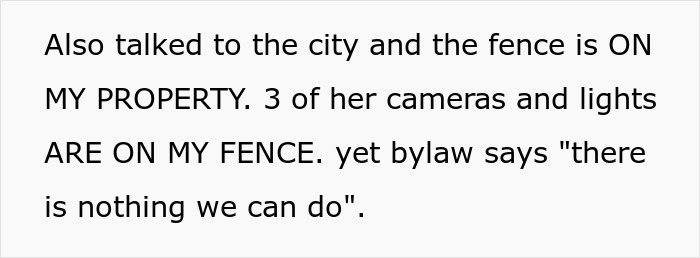 Text discussing city dispute over neighbor's cameras pointed at windows. Text discussing city dispute over neighbor's cameras pointed at windows.