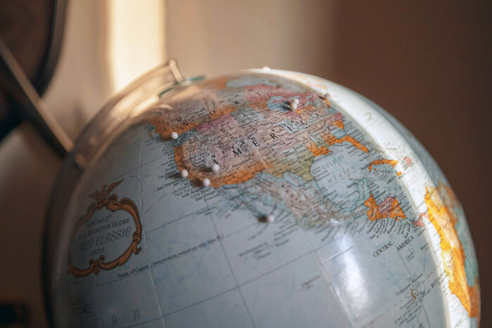 A close-up of a globe, highlighting North America, symbolizing historical facts and geographic teachings.