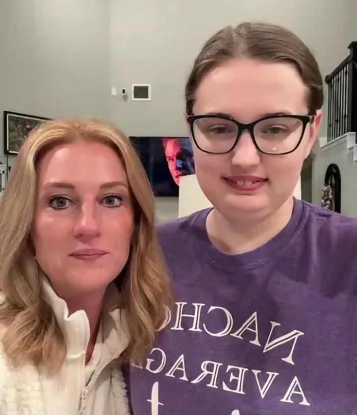 Two women indoors, smiling at the camera, highlighting heart attack awareness.