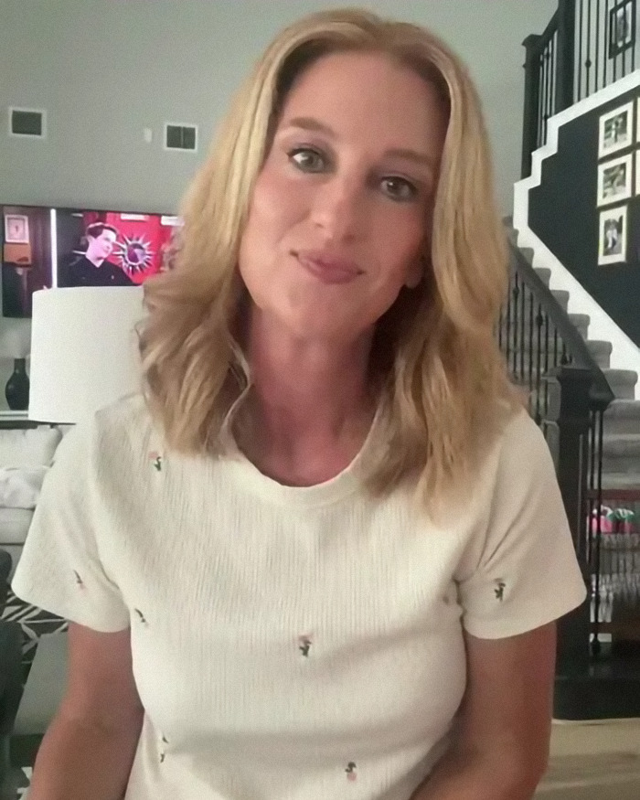 Woman in white shirt discussing subtle signs of heart attack in a living room setting.