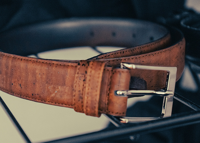 Brown leather belt on a wire rack, reflecting childhood experiences that were unknowingly traumatic.