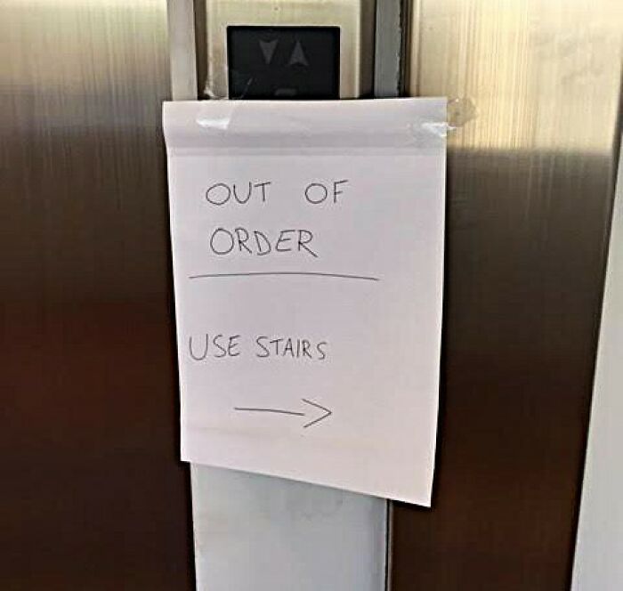 Elevator with prank sign saying "Out of Order, Use Stairs" for a fun April Fools’ joke.