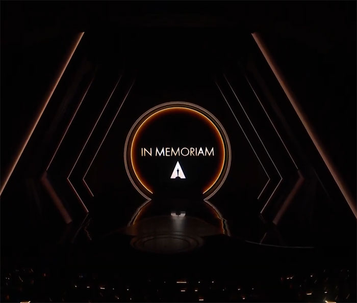 Oscars In Memoriam section with illuminated stage backdrop at the ceremony.