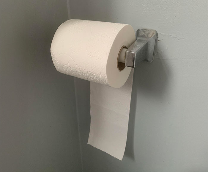 Toilet paper roll flipped incorrectly on holder, highlighting controlling tendencies issues. Toilet paper roll flipped incorrectly on holder, highlighting controlling tendencies issues.