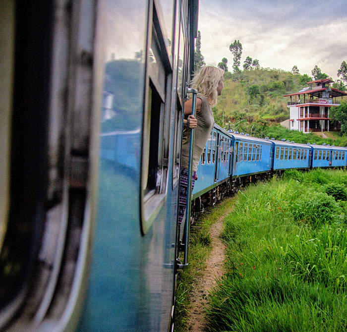 Tourist leans out of moving train for photo, illustrating the need for a physical dose of common sense. Tourist leans out of moving train for photo, illustrating the need for a physical dose of common sense.