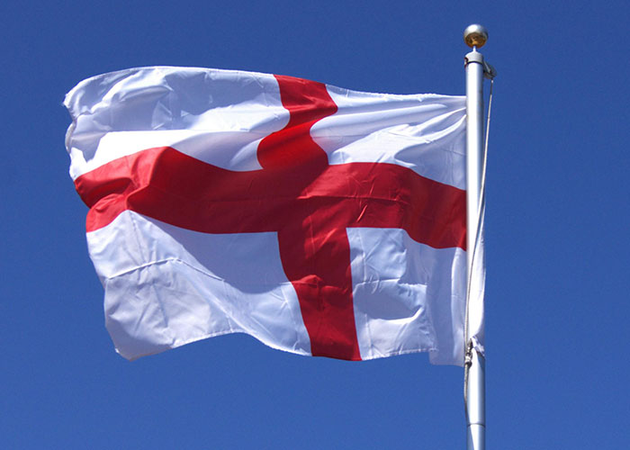 Flag with a red cross on white, symbolizing a country often teased by others.