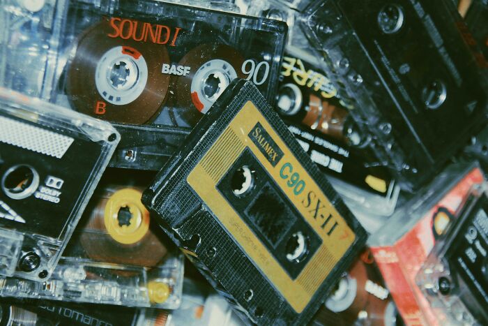 Cassette tapes stacked together, evoking &rsquo;70s and &rsquo;80s nostalgia.
