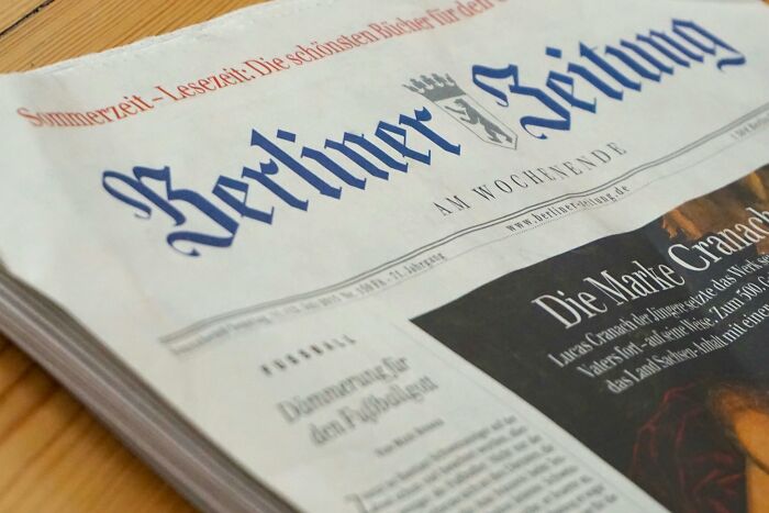 A close-up of a Berliner Zeitung newspaper with visible headlines.