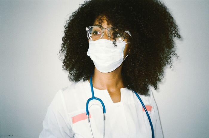 Medical professional wearing a mask and stethoscope, received heartfelt compliments.