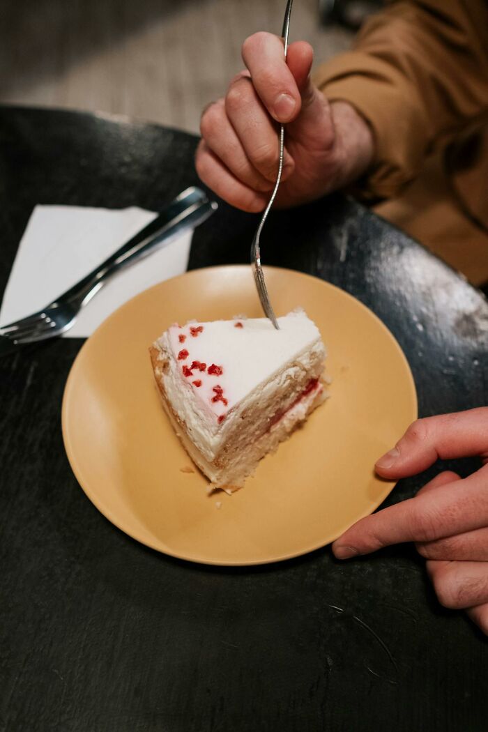 A slice of cake on a plate, symbolizing the worst bonus received in a job.