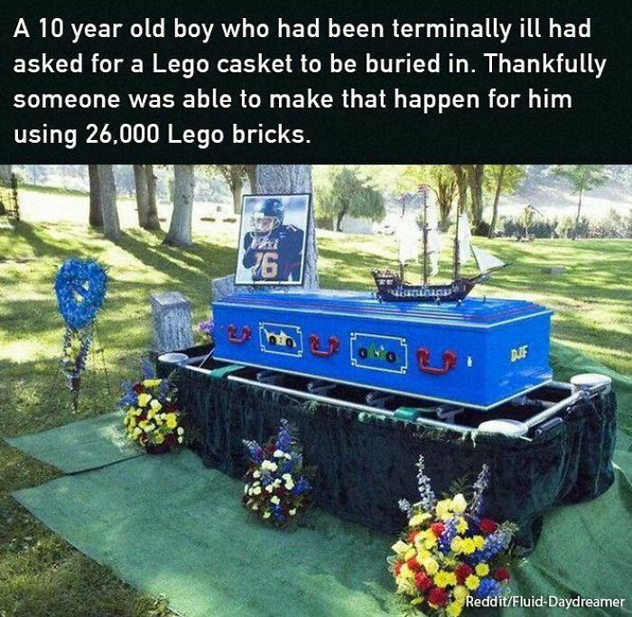 LEGO casket at a funeral, adorned with flowers and a ship model, showcasing positive and uplifting creativity.