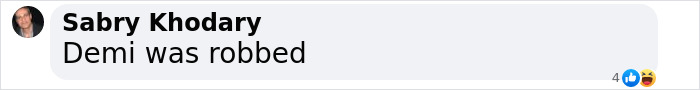 Comment on Demi's Oscars reaction, stating "Demi was robbed" with user profile image.