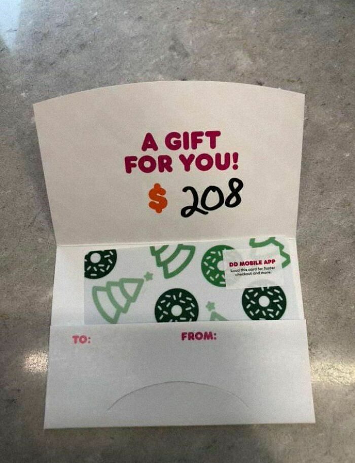 Gift card with $208 inside an open envelope, featuring festive designs and text, "A gift for you!"