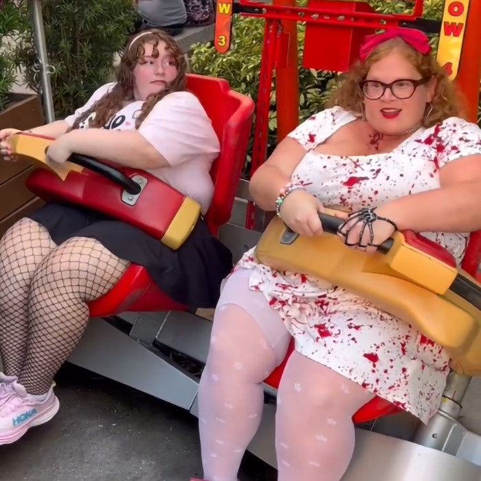 Plus-size park hoppers seated on an amusement ride, showcasing empowerment for plus-size people. Plus-size park hoppers seated on an amusement ride, showcasing empowerment for plus-size people.