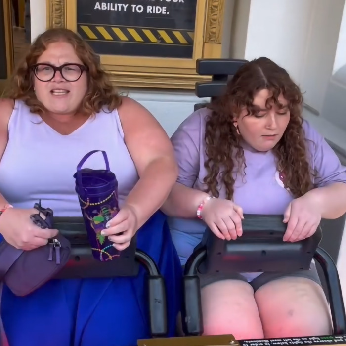 Two plus-size individuals enjoying a park hopper ride, promoting empowerment for plus-size people. Two plus-size individuals enjoying a park hopper ride, promoting empowerment for plus-size people.