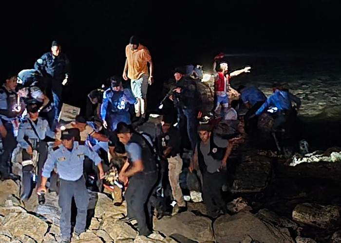 Rescue team at night scene after tragic plane crash near remote island.