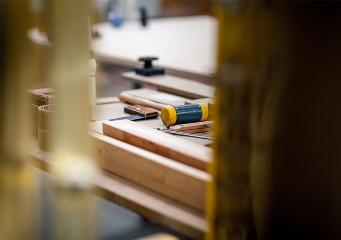 A woodworking table with tools, representing a crafted social media blunder post.