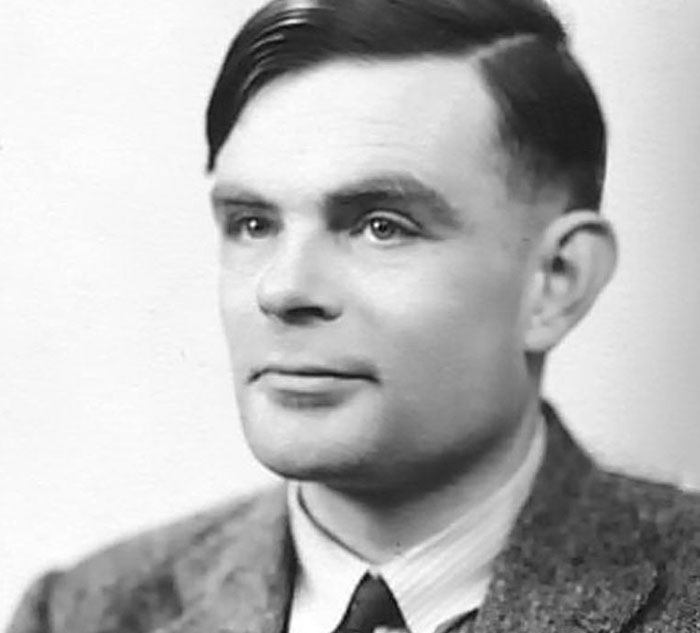 Black and white portrait of a man with a thoughtful expression, wearing a tweed jacket and tie. Opportunity to learn new facts.