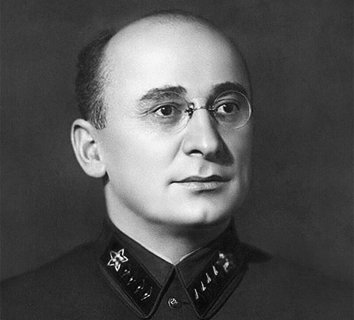 A historical figure with glasses, wearing a decorated military uniform; learn something new about history today.