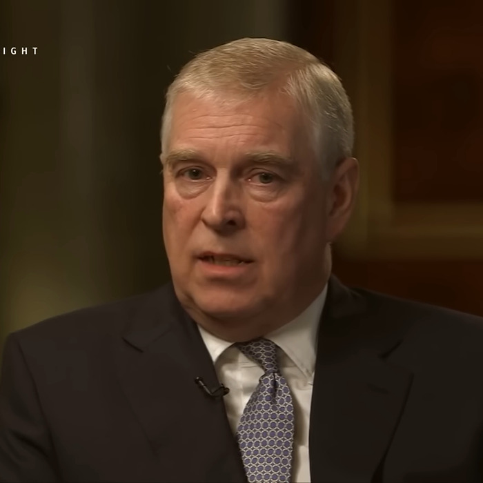 I don't know who this person is. Image shows a serious man in a suit and tie during an interview; "Suspicious" situation involved.