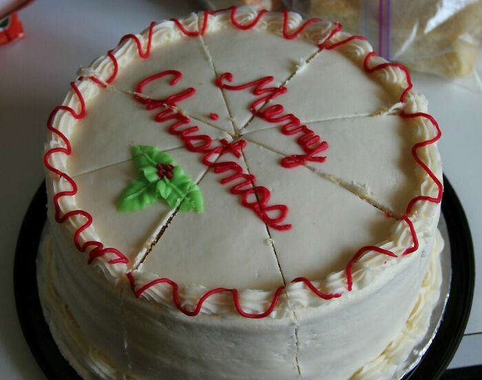 Christmas cake decorated with white frosting and red icing, showing alternative use of products.