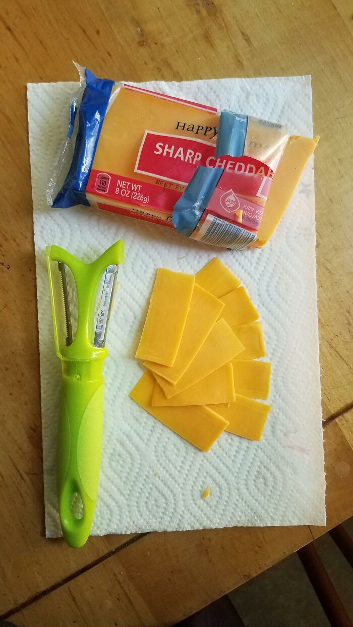 Cheese slices made using a vegetable peeler, showing a product used differently than intended.